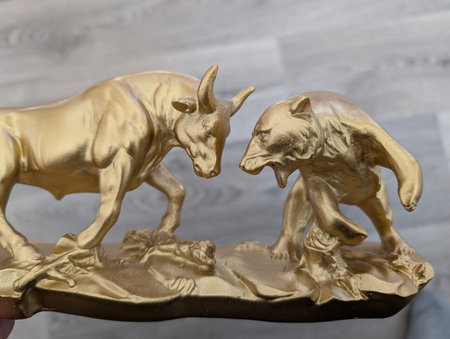 golden bull and bear as symbol of stock statueの写真素材