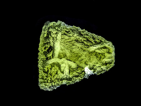moldavite mineral isolated on the black backgroundの写真素材