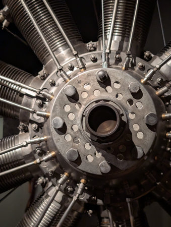 Dramatic close-up showcases intricate metallic components and powerful precision of a vintage radial aircraft engine.