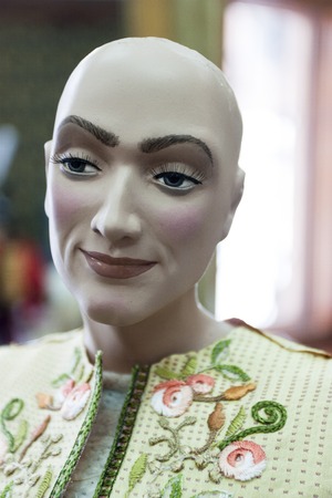 Bald marionette made from a tree in a professional Studioの写真素材