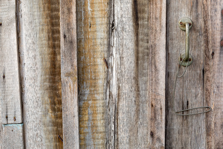 Handle of wooden door of fence photoの写真素材