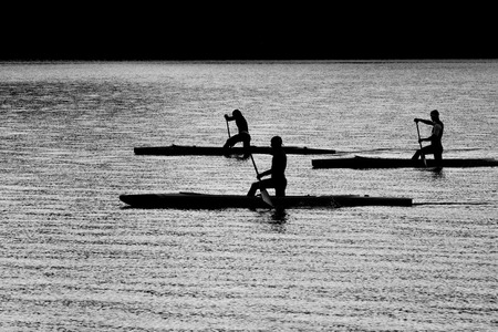 Three kayakers floating on the river . Black and white photo.の写真素材