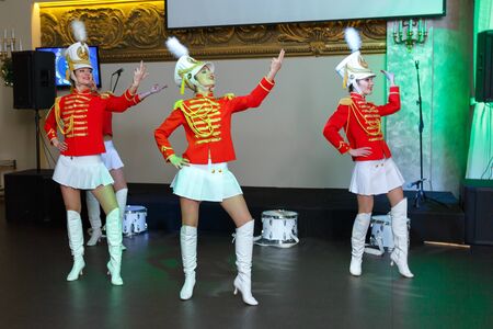 Saint Petersburg, Russia - December 15, 2017: Girls in red uniforms with drums dance. Horizontally framed shotのeditorial素材