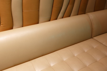 Leather, stitched, wavy texture and a sofa. Horizontally framed shotの写真素材