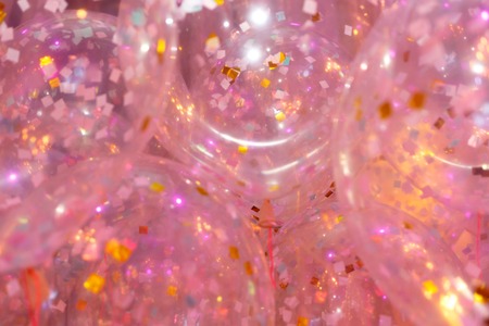 Pink balloons, bunny balloon, pink bubbles beautiful birthday texture. Golden sequins. Horizontally framed shot.の写真素材