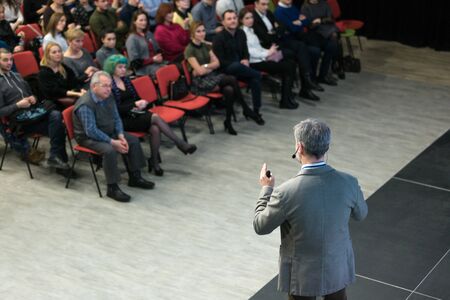 Chisinau, Republic of Moldova - March 11, 2018: speaker at Business Conference and Presentation. View from the back. Audience at the conference hall. Horizontally framed shot.のeditorial素材