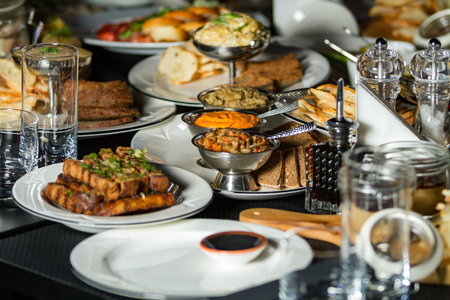 Festively set table with food. Horizontally framed shot.の写真素材