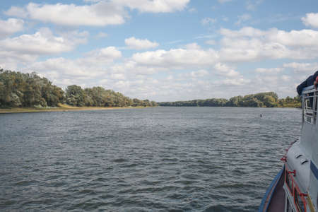 River view from a pleasure boat. Horizontally framed shot.