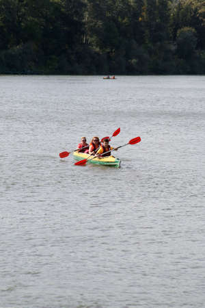 Chisinau, Republic of Moldova - October 04, 2020: Kayakers swim along the river. Vertically framed shot.のeditorial素材