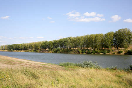 River landscape. Deserted sandy beach. Horizontally framed shot.の写真素材
