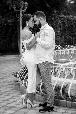 Stylish couple gently hugging. Happy sensual wedding couple embracing. Romantic moments of newlyweds. Vertically framed shot.の写真素材