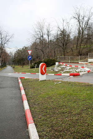 Road signs. Red and white curb.の写真素材