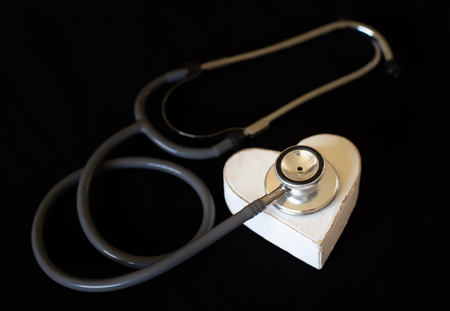A stethoscope and hand-crafted heart symbolise good health and a healthy lifestyle.の写真素材