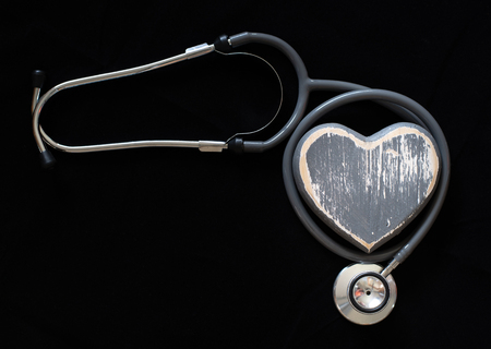A stethoscope and hand-crafted heart symbolise good health and a healthy lifestyle.の写真素材