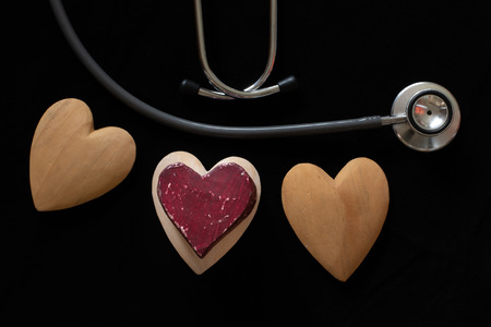A stethoscope and hand-crafted heart symbolise good health and a healthy lifestyle.の写真素材