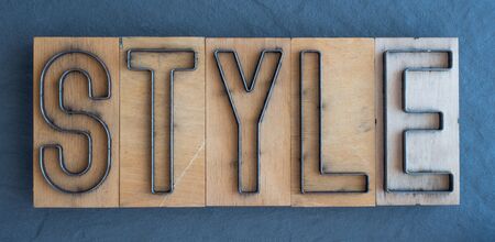 Old wood and steel number plate dies spell out the word STYLEの写真素材