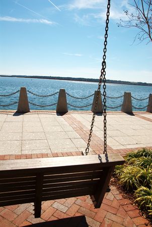 Wooden swinging benchの写真素材