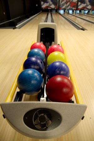 Bowling balls in the rack at a bowling alley.の写真素材