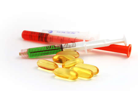 some different colour droppers and pillsの写真素材