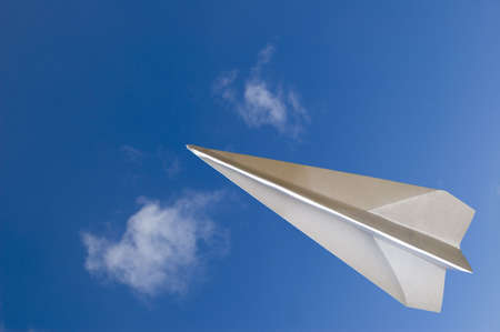 Paper airplane fly across the top - Contain the "clipping path" for the paperplane to let you select on the plane itself and cut/copy it to your designの写真素材