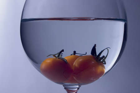 Close up view of tomato inside the wine glassの写真素材