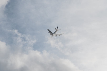Airplane in the cloudy skyの写真素材