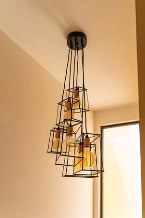 modern iron lamp hanging ceiling, home decor, vintage bulb light low angle view