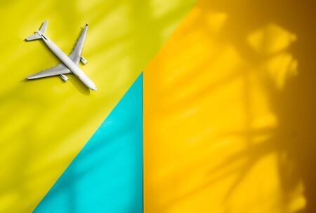Airline advertising template with an airplane toy flying in colorsの写真素材