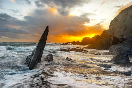 Sunset at Ayrmer Cove on the South Devon coast in the UK.の写真素材