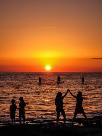 Beautiful orange sunset on the beachの写真素材
