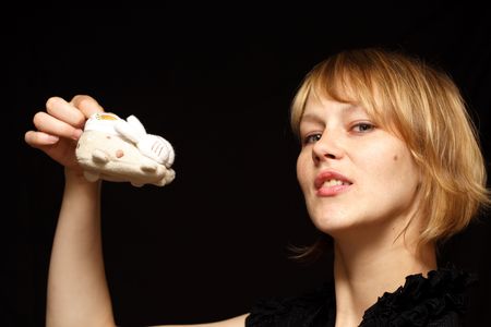 woman holding little baby shoesの写真素材