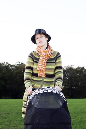 happy mothe on the park with buggyの写真素材