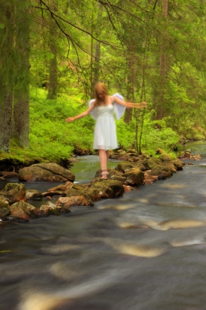 Angel walking on the rocksの写真素材