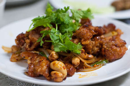Stir-Fried Chicken with Cashew Nuts on white dish, Thai foodの写真素材