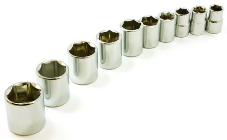Chrome ratchet sockets in a curve, on white backgroundの写真素材