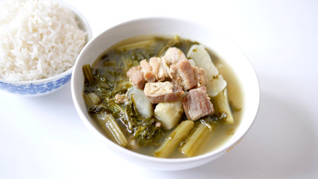 Chinese vegetables stew, mixture of white radish, Cantonese vegetable, pork belly and a bowl of rice on white background,  traditional Chinese foodの写真素材