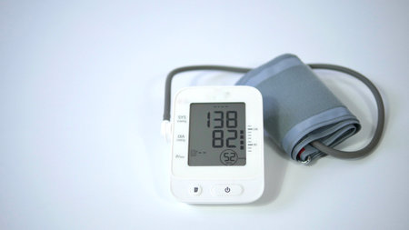 Electronic blood pressure meter and cuff on white background, Medical electronic tonometer check blood pressure, Health and Medical conceptの写真素材