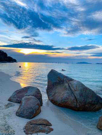 A beach scene at Lipe Island, rock on beach at sunset, Satun, Thailandの写真素材