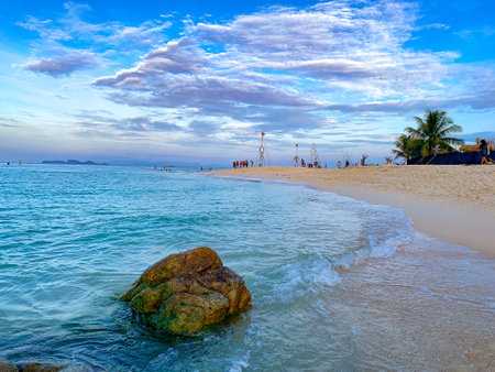 A beach scene at Lipe Island, rock on beach at sunset, Satun, Thailandの写真素材