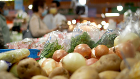 Blurred background of marketplace in Bangkok, People shopping fresh vegetables in market,  consumerism and people conceptの写真素材
