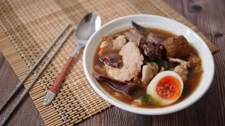 Noodle roll soup (Paste of rice flour) with pork and boiled eggの写真素材