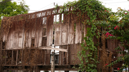 deteriorated abandoned wooden old house in Thailandの写真素材