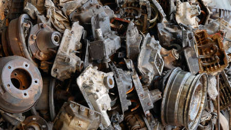 Pile of old machine parts in second hand machinery shop, background of damage and rusty old car machineの写真素材