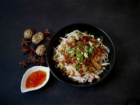 Rice flat noodle with dried shrimp,  ground pork, squid, tofu and beansprout in sweet black soy...