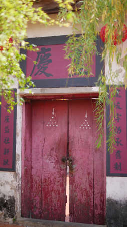 February  21 2021 - Bangkok, Thailand : Chinese old red door in the Temple.のeditorial素材