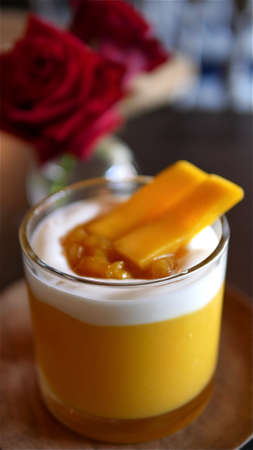 Blurred of yogurt mango smoothie, healthy food and drink conceptの写真素材