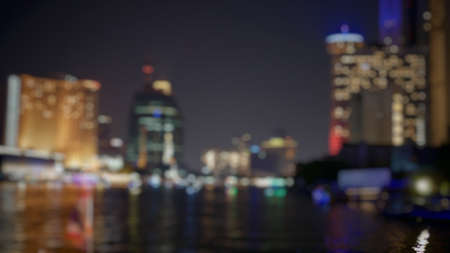 Blurred cityscape  waterfront at night, abstract backgroundの写真素材