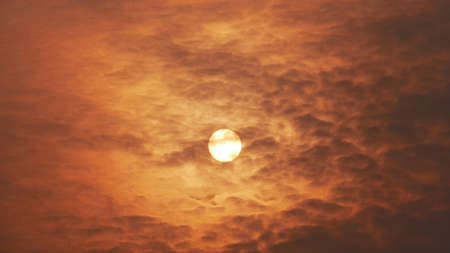 Brilliant orange sunset in summer season, sunset in warm summer sky.の写真素材