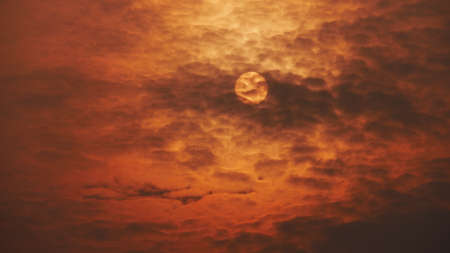Brilliant orange sunset in summer season, sunset in warm summer sky.の写真素材