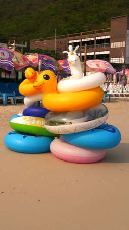 March 15 2021 - Koh Larn, Thailand : Cartoon Inflatable ring on beach for rentの写真素材